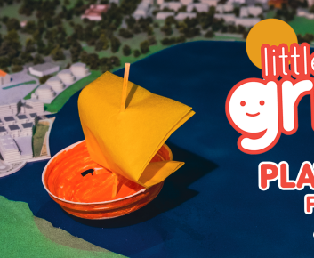 Little Griffins logo and info with small handmade arts and crafts boat on 4D model map of Lake Burley Griffin