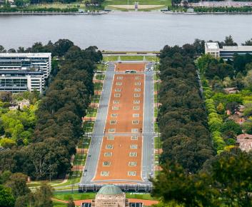 Anzac Parade as seen from Mount Ainslie, with green trees flanking each side